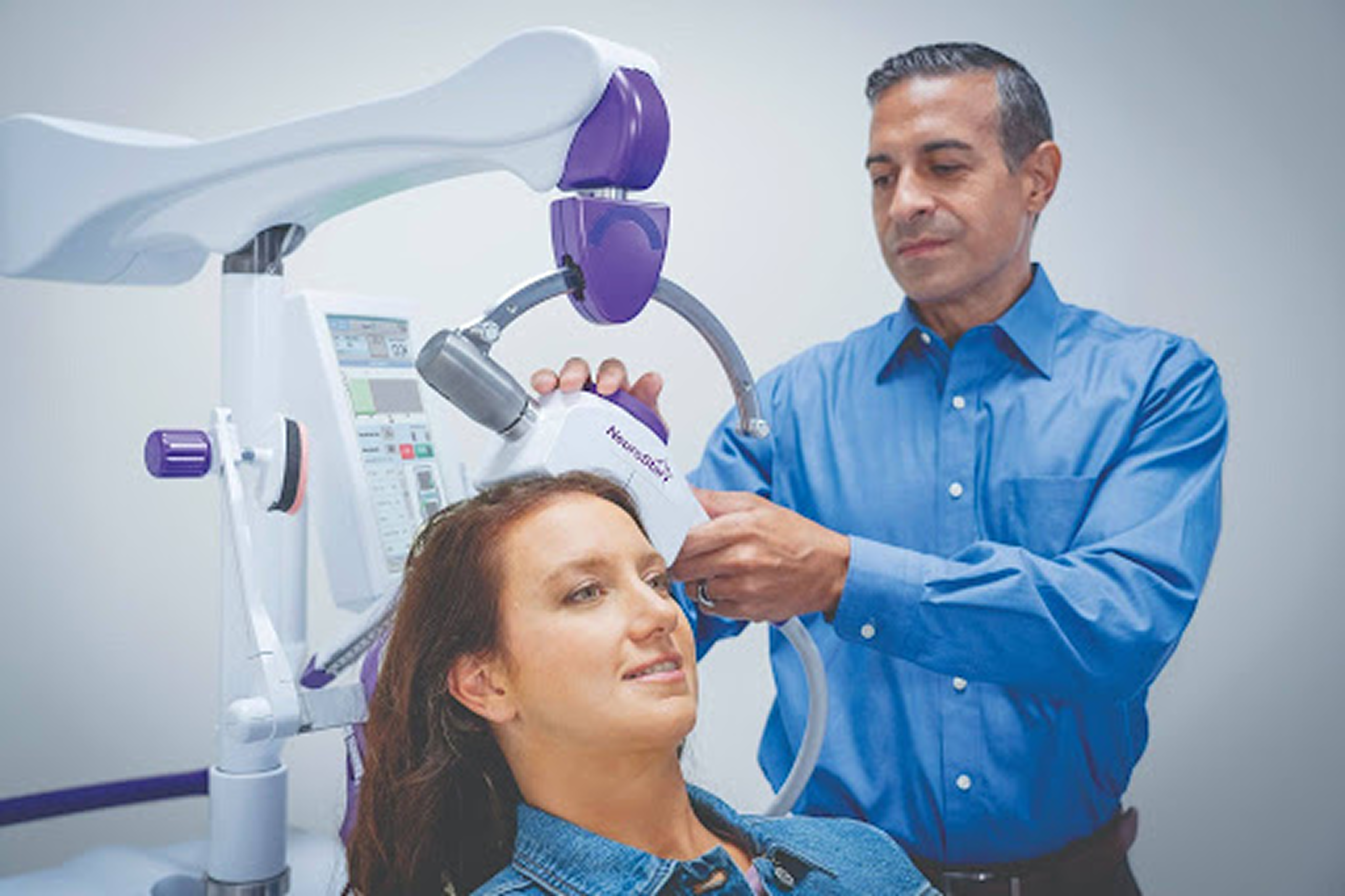 A clinician positions a NeuroStar device on a patient, what conditions is TMS FDA-approved for guides treatment decisions.